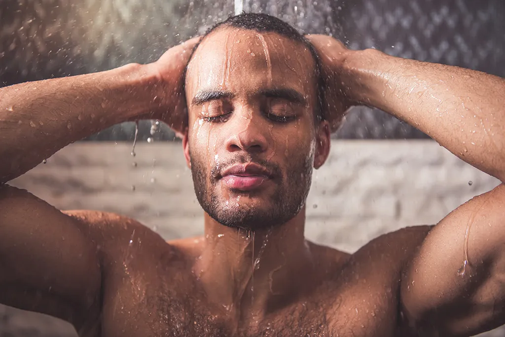 Man takes a warm shower, maximizes his body clock.