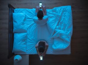 Couple who can't sleep in a Sleepless City.