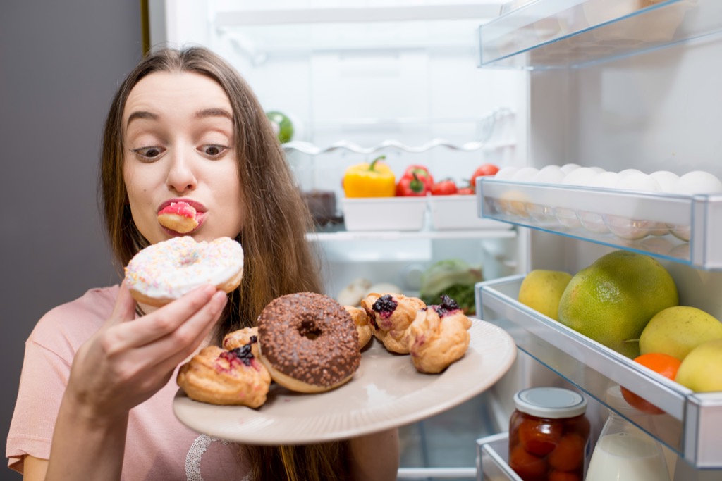 woman eating donuts advice you should ignore over 40