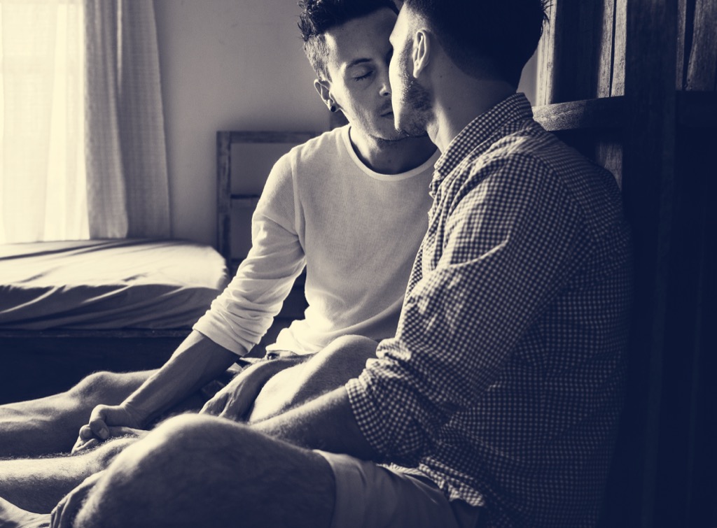 gay couple kissing on a bed - literotica