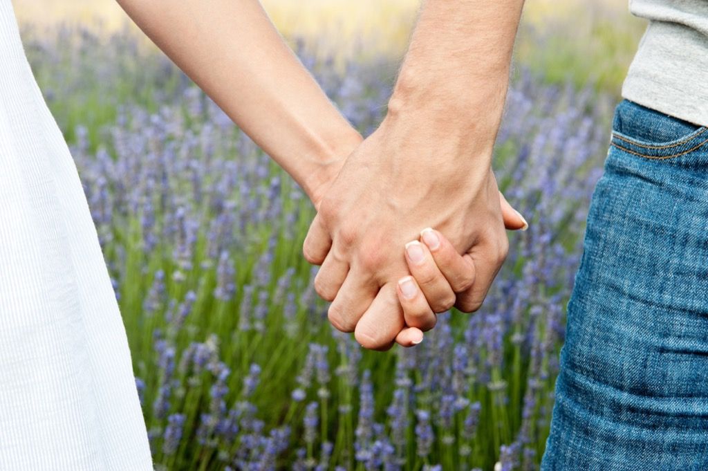 couple holding hands commitment