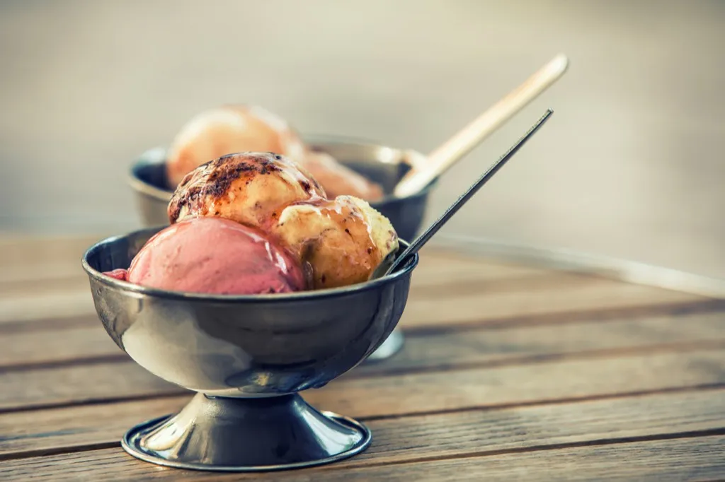 an ice cream sundae on a wooden table