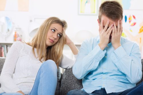 upset couple on couch