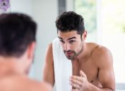 shirtless man in mirror