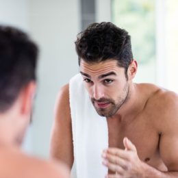 shirtless man in mirror