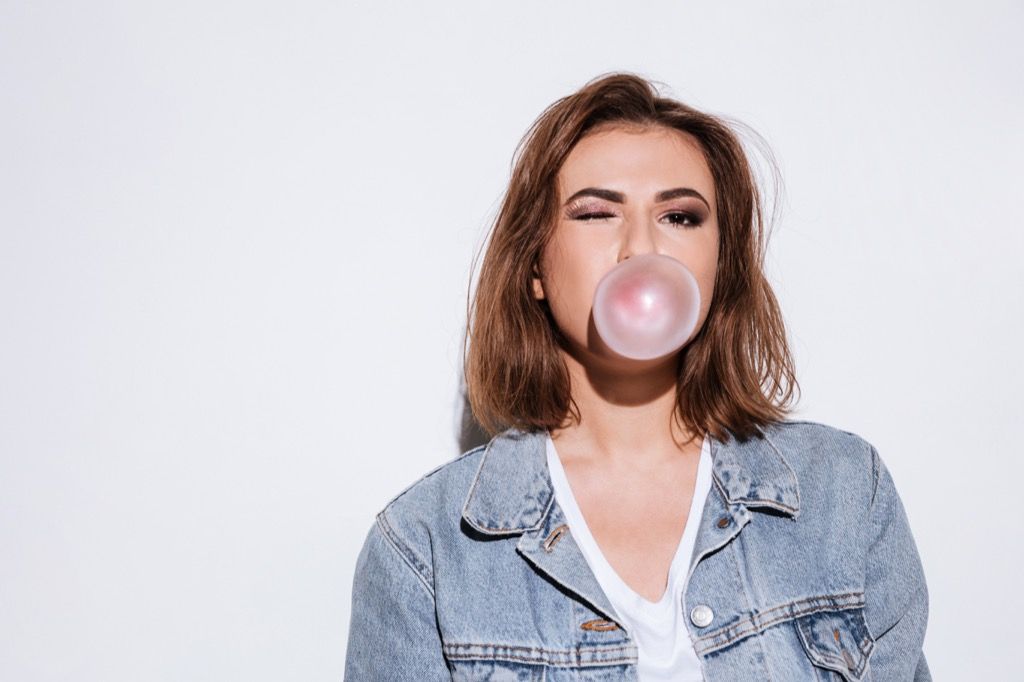 woman chewing gum bubble