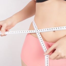 woman measuring tape weight loss