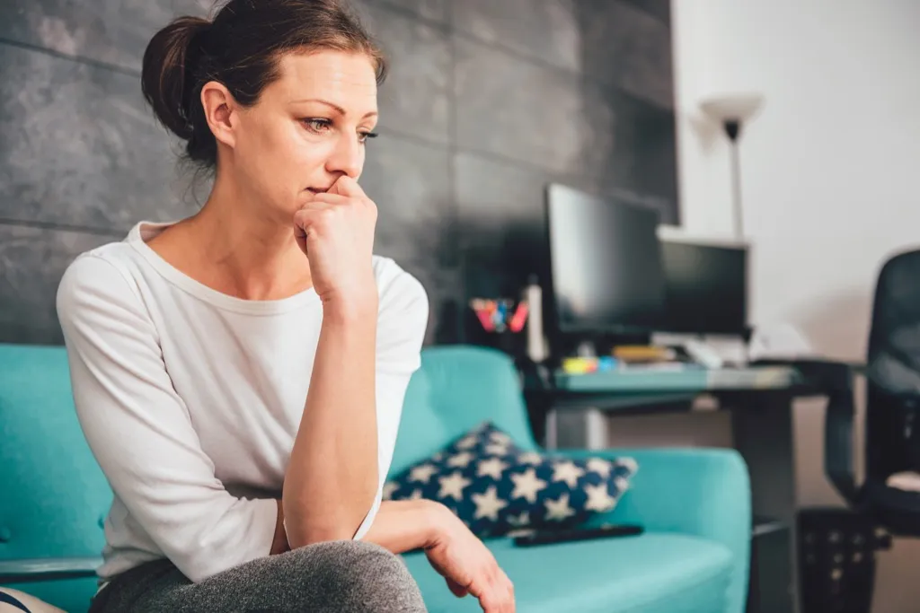 woman thinking about the past 40 things you shouldn't believe after 40