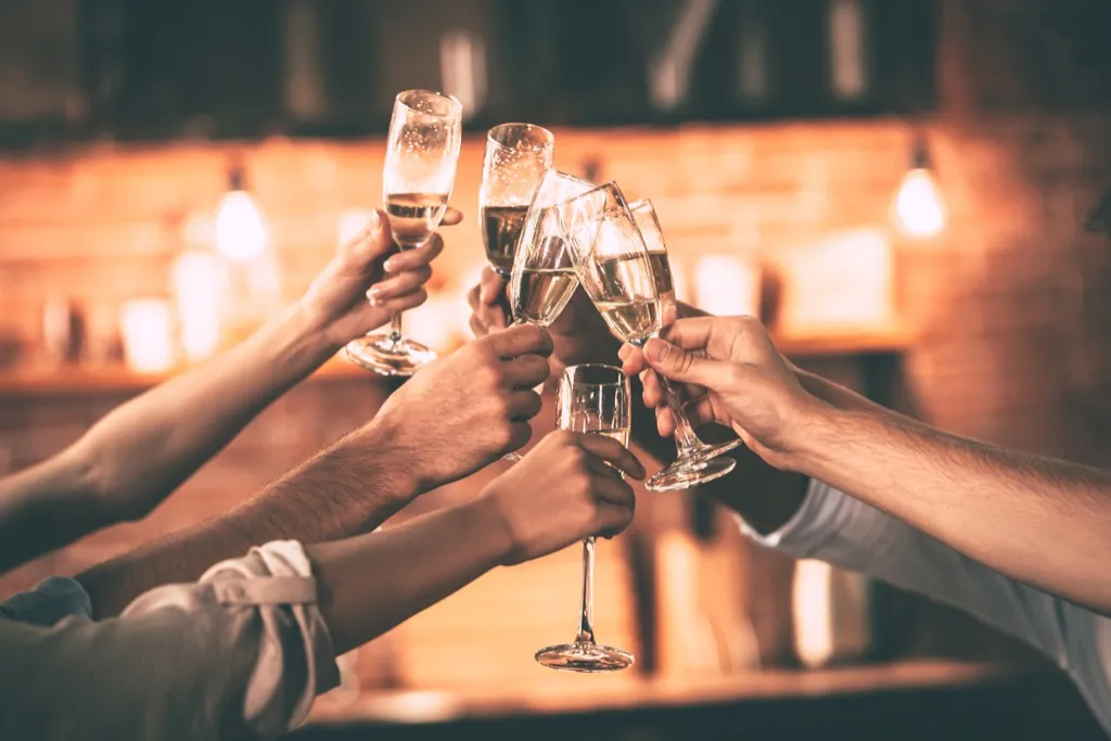 Group of friends toasting with champagne flutes
