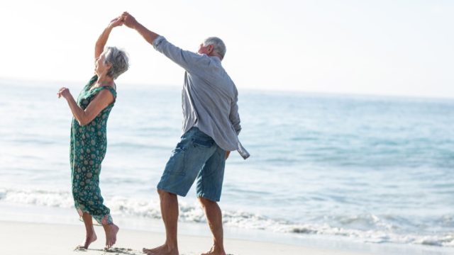 elderly couple on beach marriage last forever