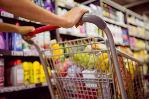 Woman pushing grocery cart