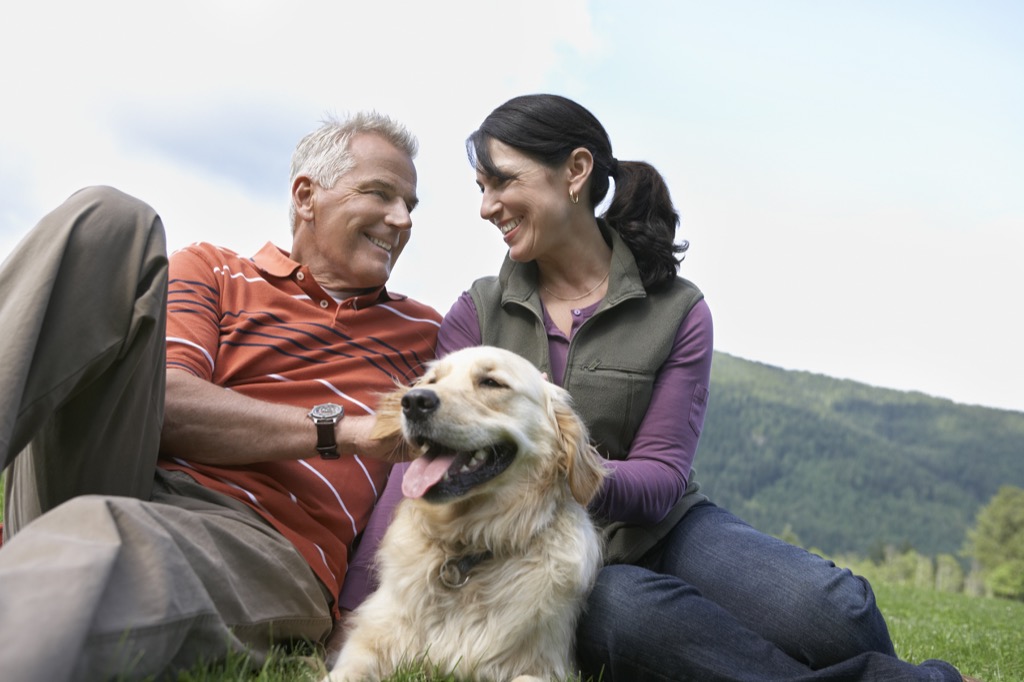 couple smiling with dog