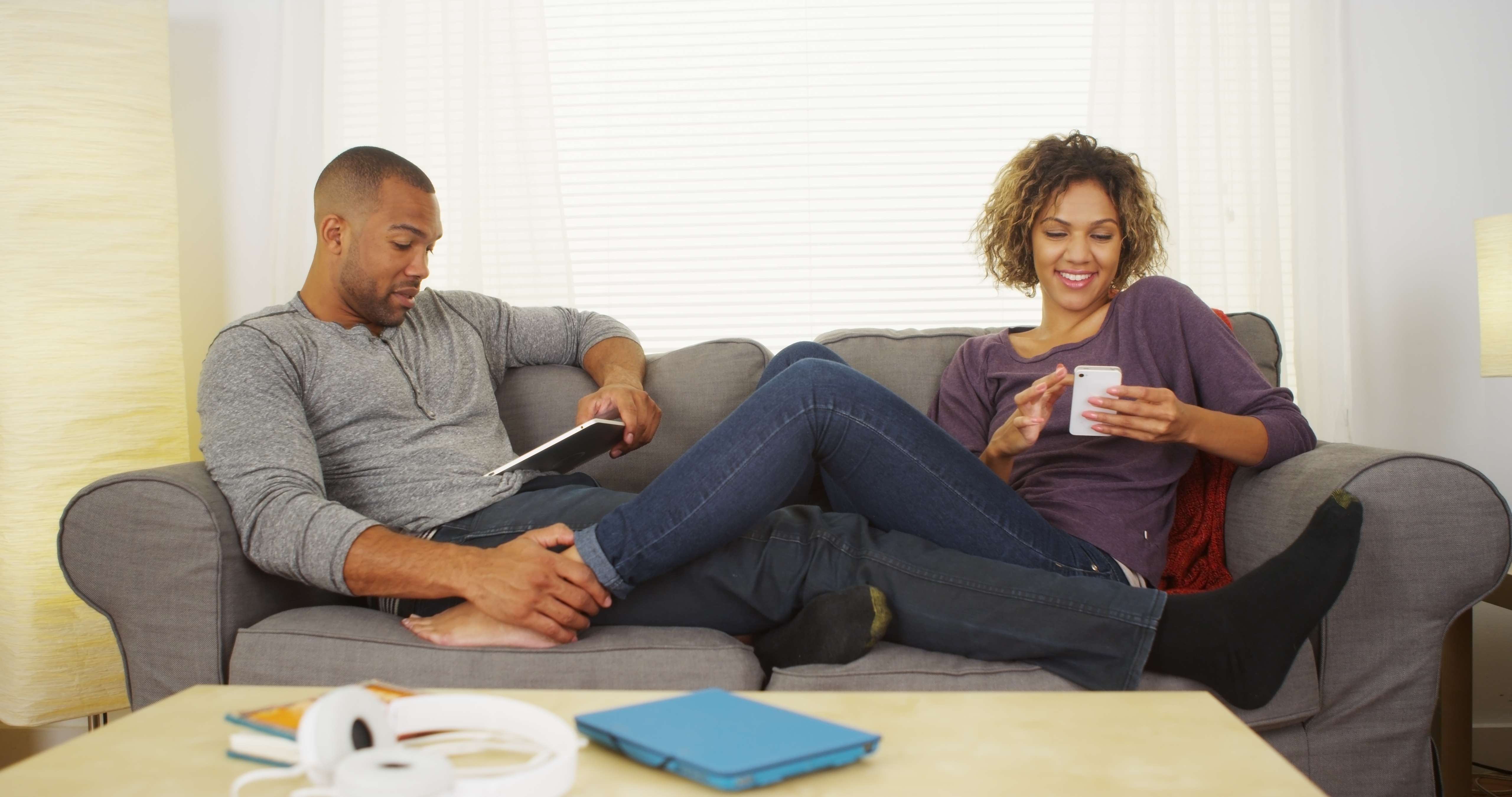 man and woman sitting lovingly on couch, what he wants you to say