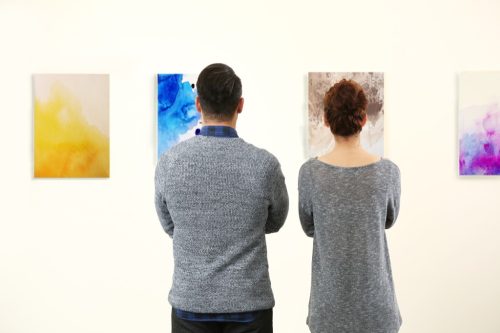 couple looking at art at museum