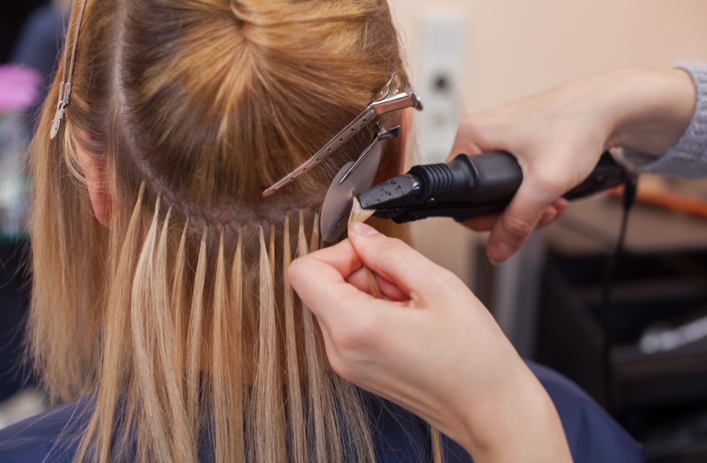 woman getting hair extensions looking younger