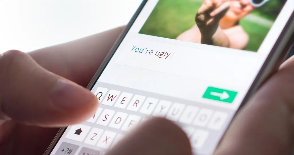 message that reads "you're ugly" on smartphone, parenting is harder