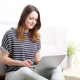 Woman typing on computer