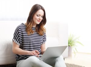 Woman typing on computer