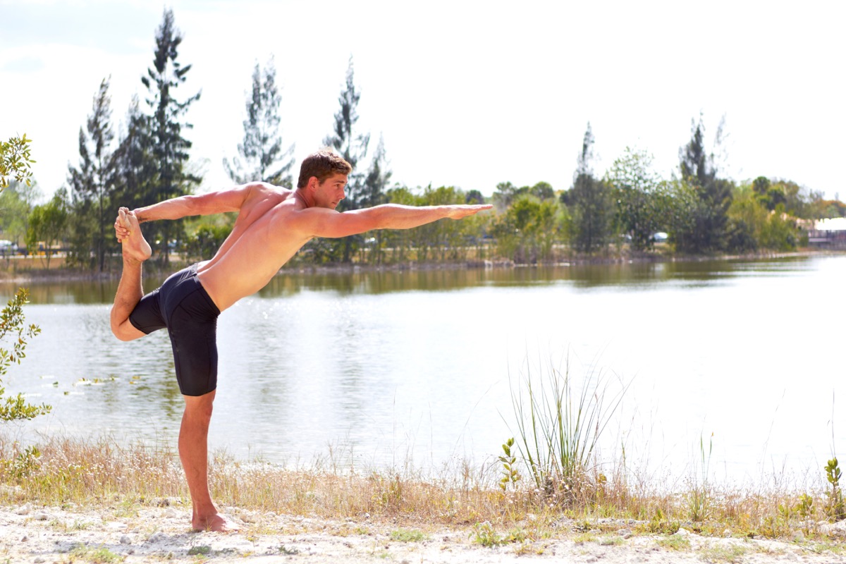 Man Doing Yoga and Balancing on One Leg Healthy Man
