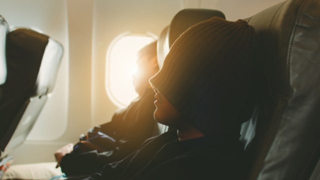 People sleeping on an airplane.