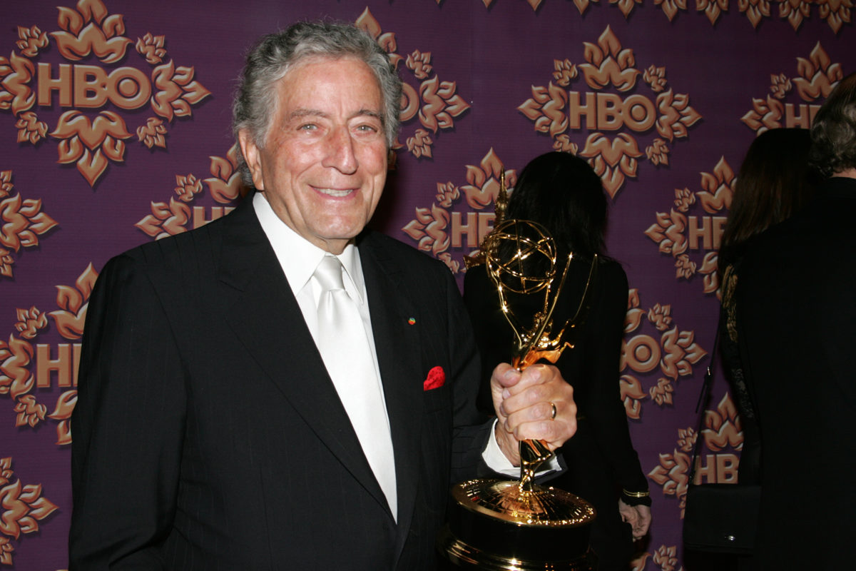 Tony Bennett holding an Emmy