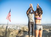 Couple celebrates on top of hill, representing their resolutions