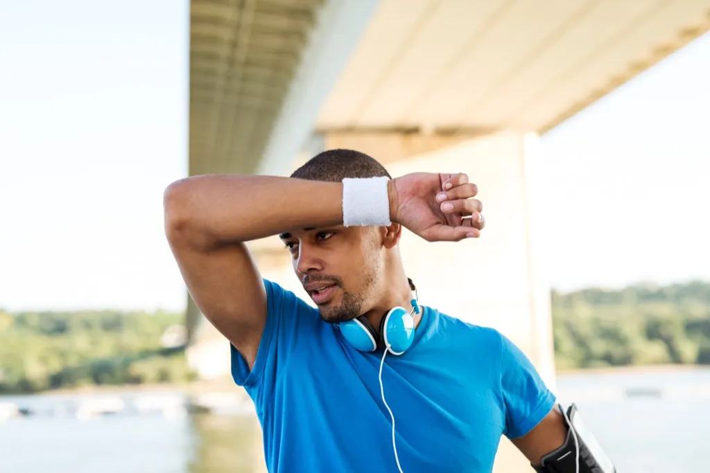 man exercising outside under a bridge, weight loss motivation 