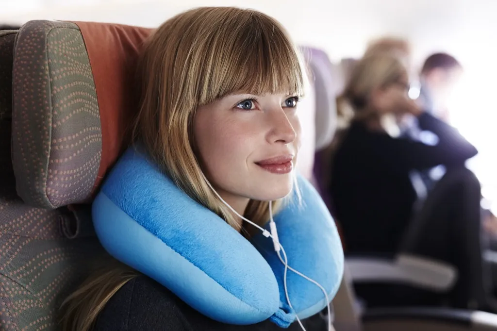 using a neck pillow on a flight will ensure a smooth trip airplane sleep tips