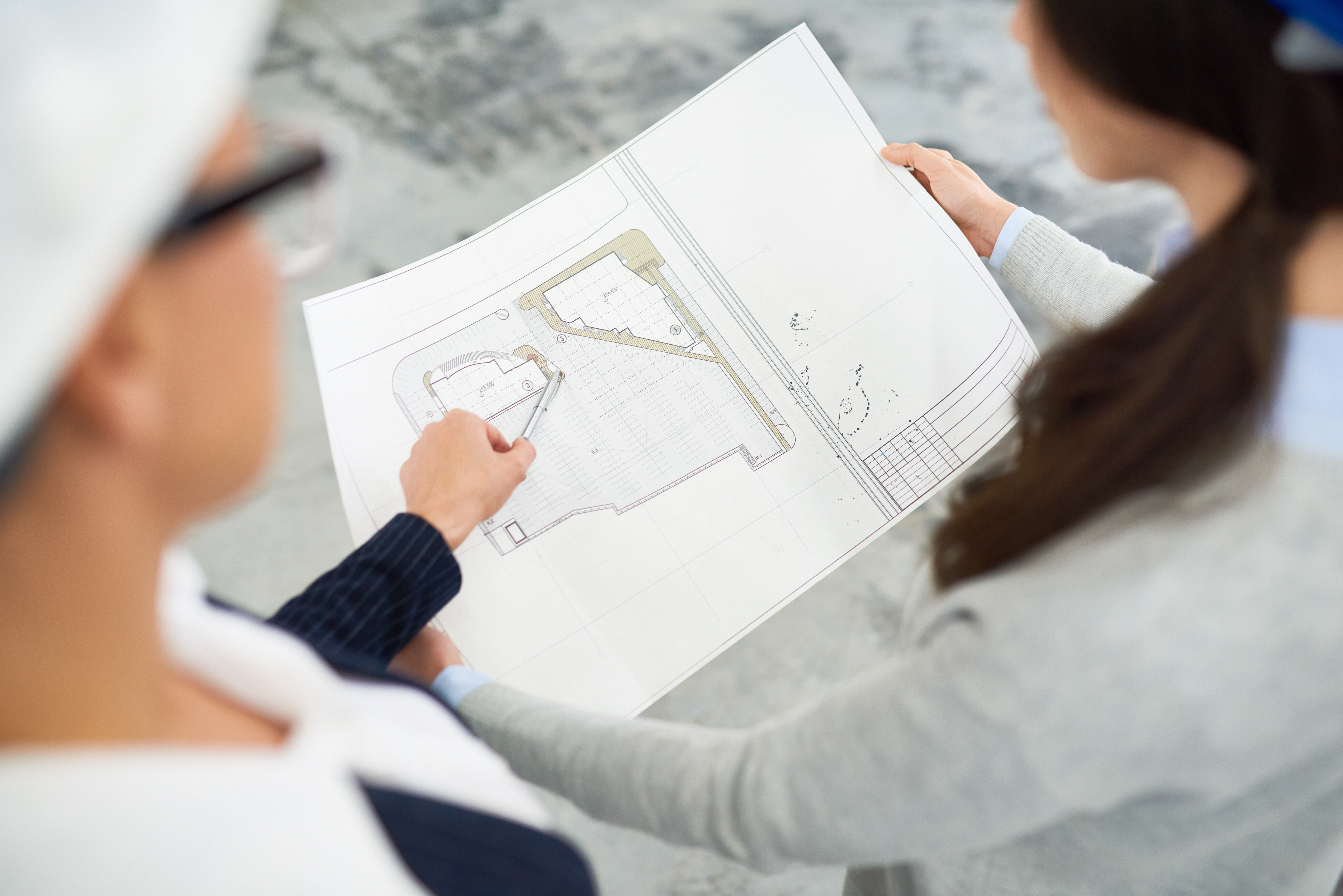 New home buyer inspecting blueprint