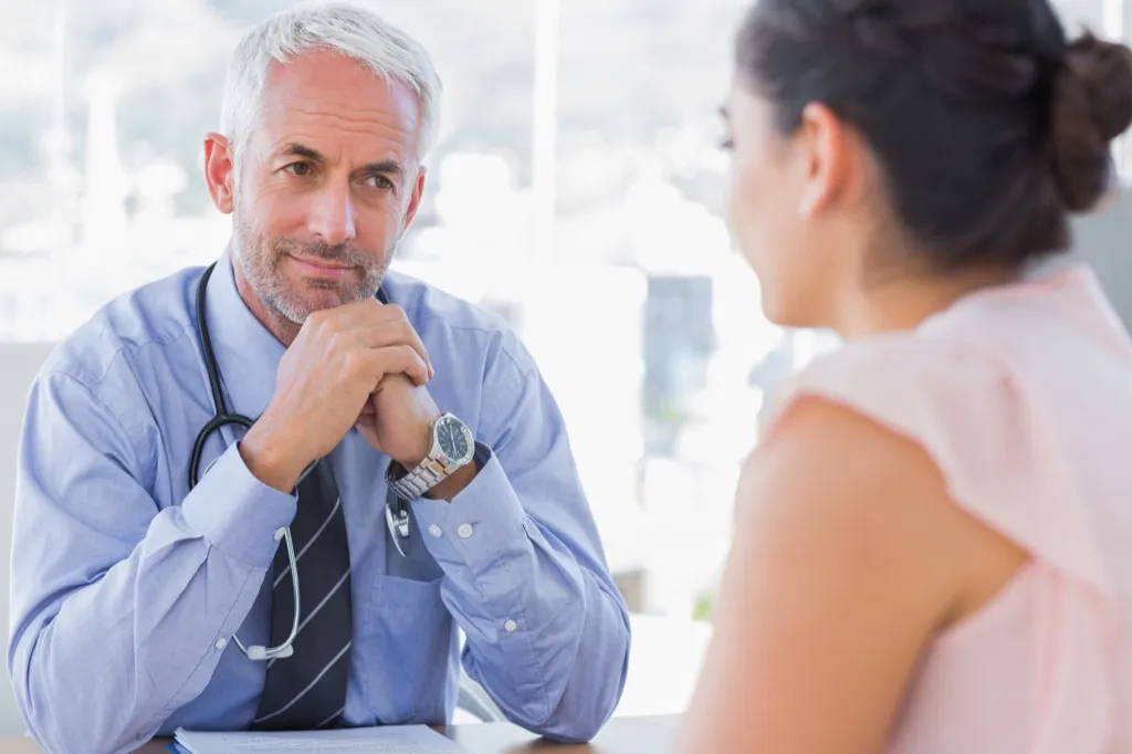 woman meeting with her doctor Wealth-Building Tips 
