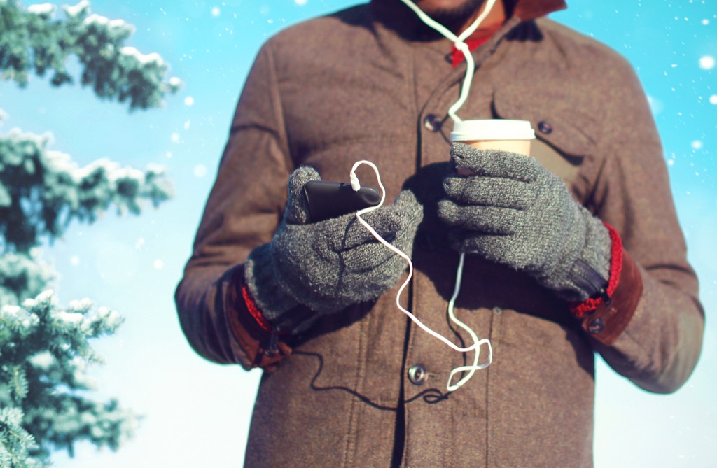 Man listening to podcast in the winter