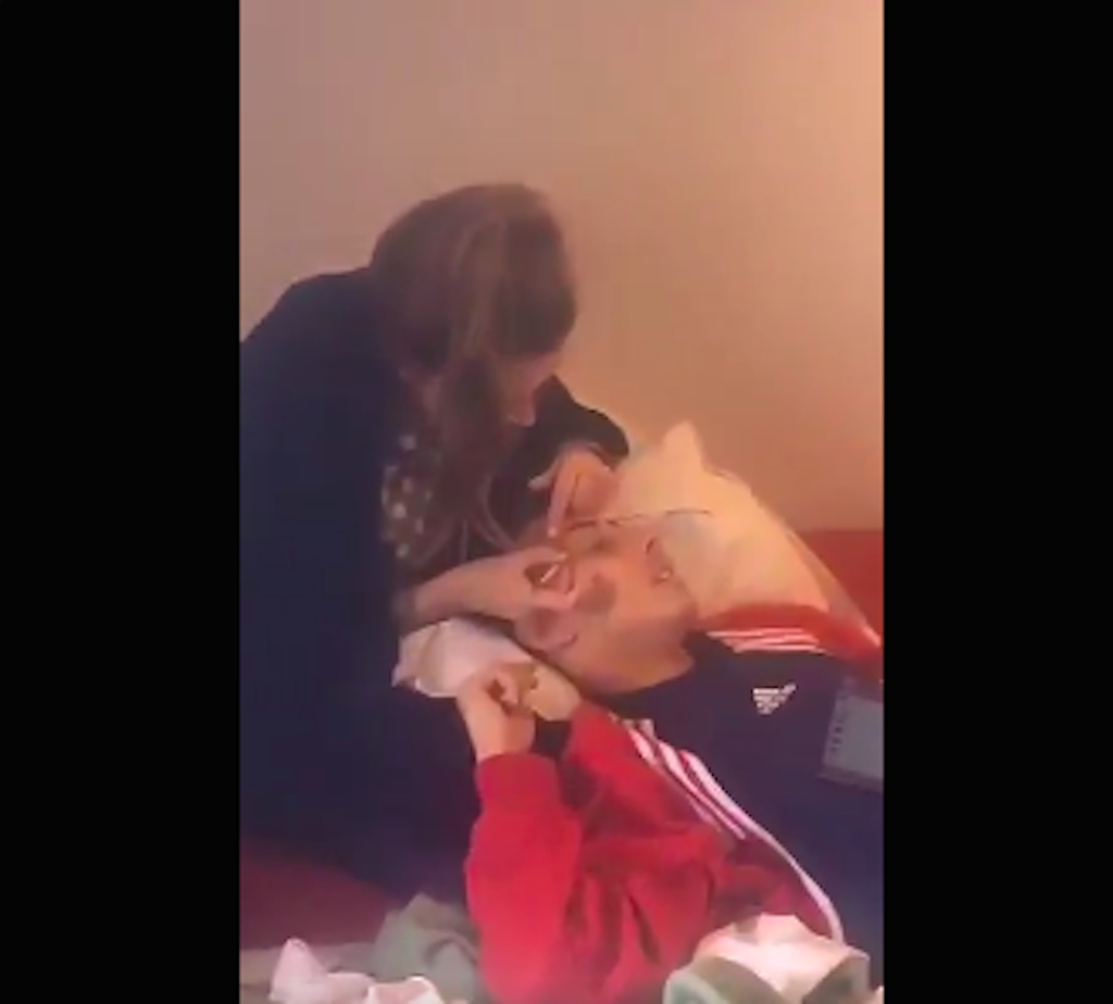 woman plucking boy's eyebrows coed