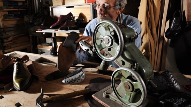 Craftsman making luxury handmade man shoes