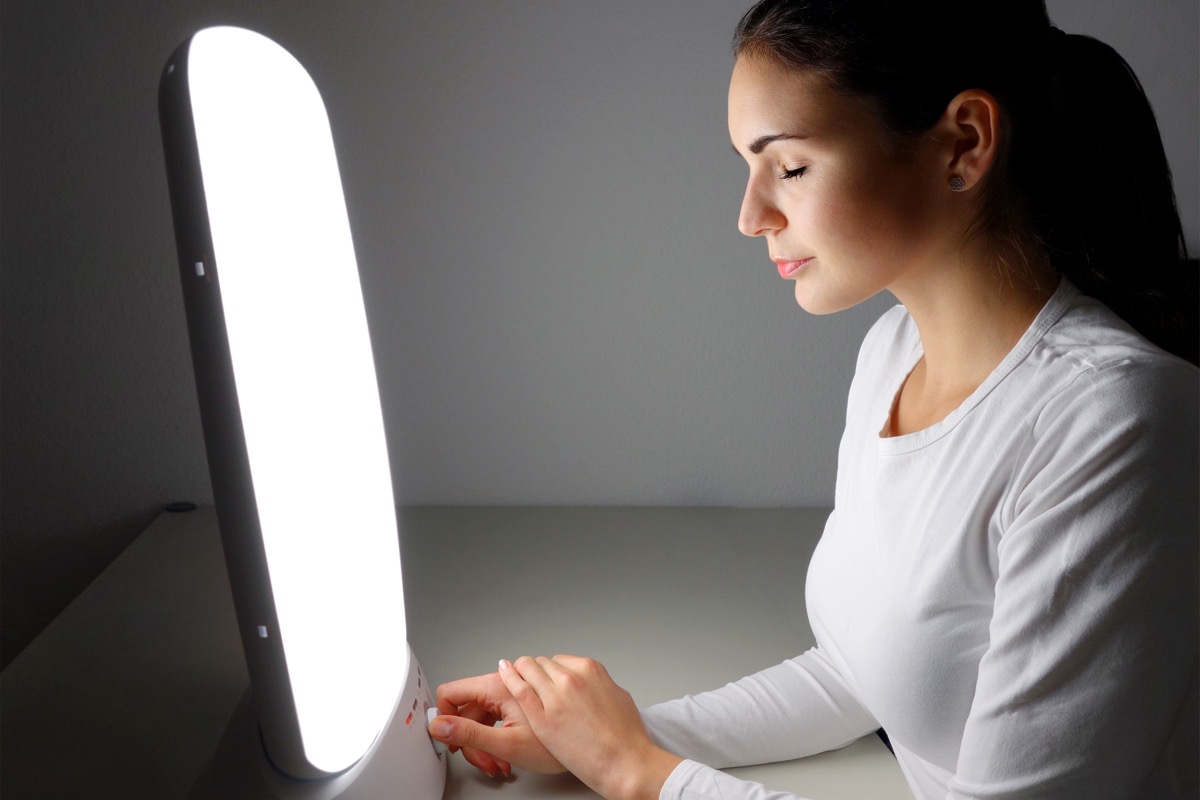 Woman getting light therapy for her seasonal depression