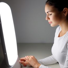 Woman getting light therapy for her seasonal depression