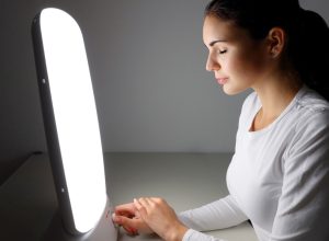 Woman getting light therapy for her seasonal depression