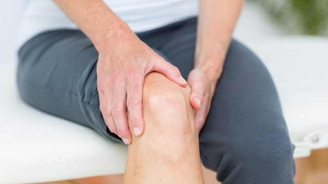 man with knee pain, health questions over 40