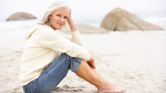 older woman on beach dating over 50