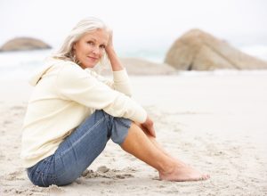 older woman on beach dating over 50