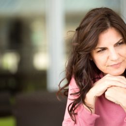 woman looking sad outdoors, worst things about an empty nest
