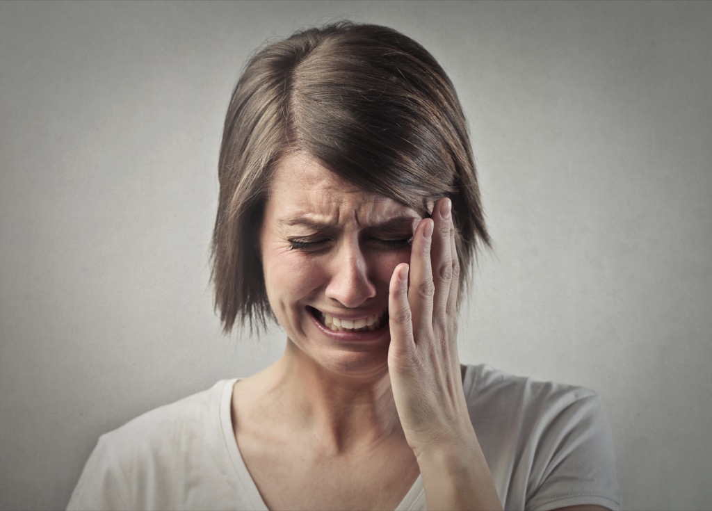 Woman weeping because she didn't use these wealth-saving tips