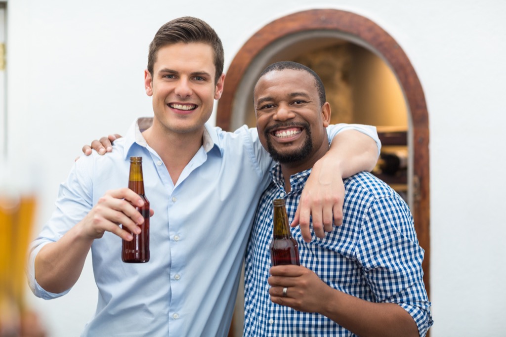 white man and black man enjoy beer, things not to say to single people