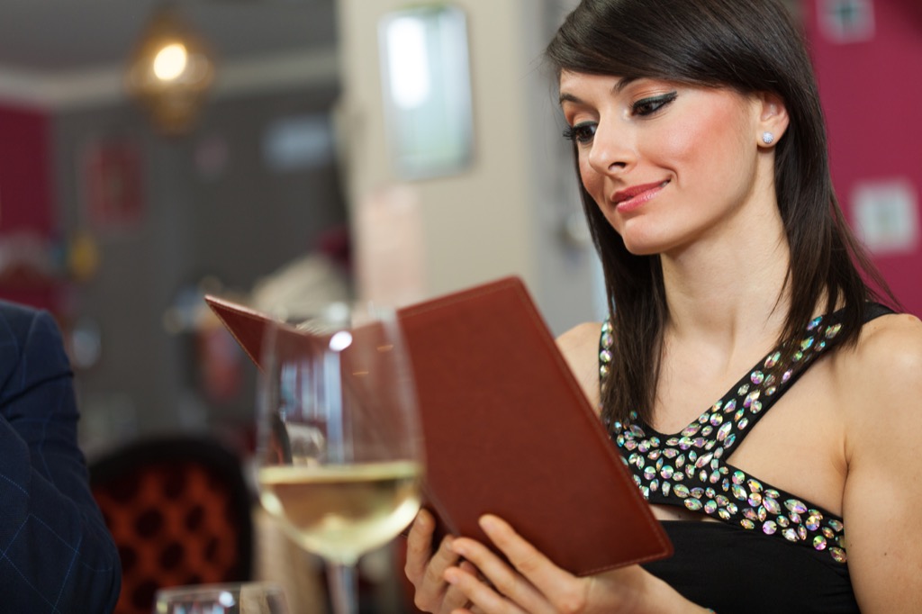 woman reading a menu