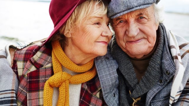elderly couple in hats