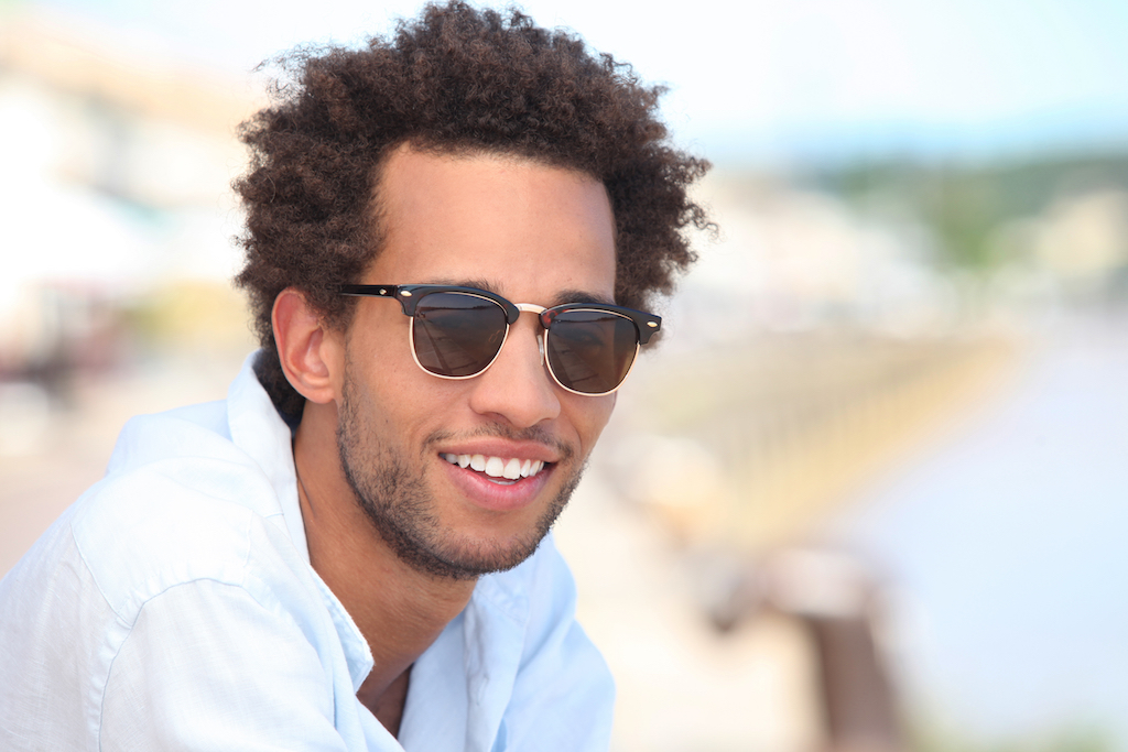 Man outside wearing sunglasses, skin cancer facts