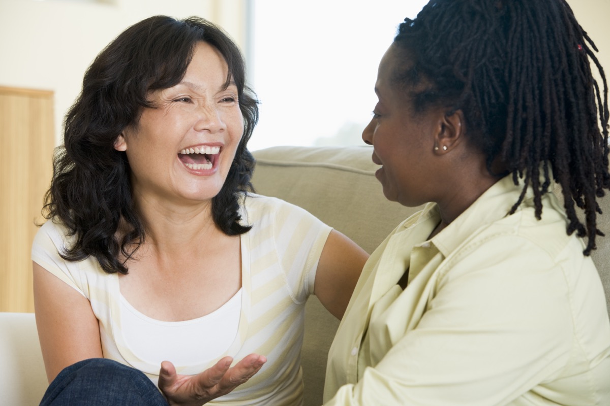 Multicultural women talking and laughing