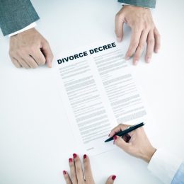 couple signing divorce papers, empty nest