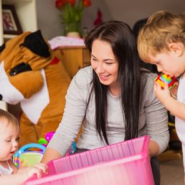 babysitter playing with kids, working mom