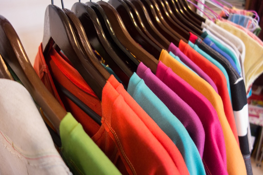 colorful sweaters on a rack - how to dress over 50 