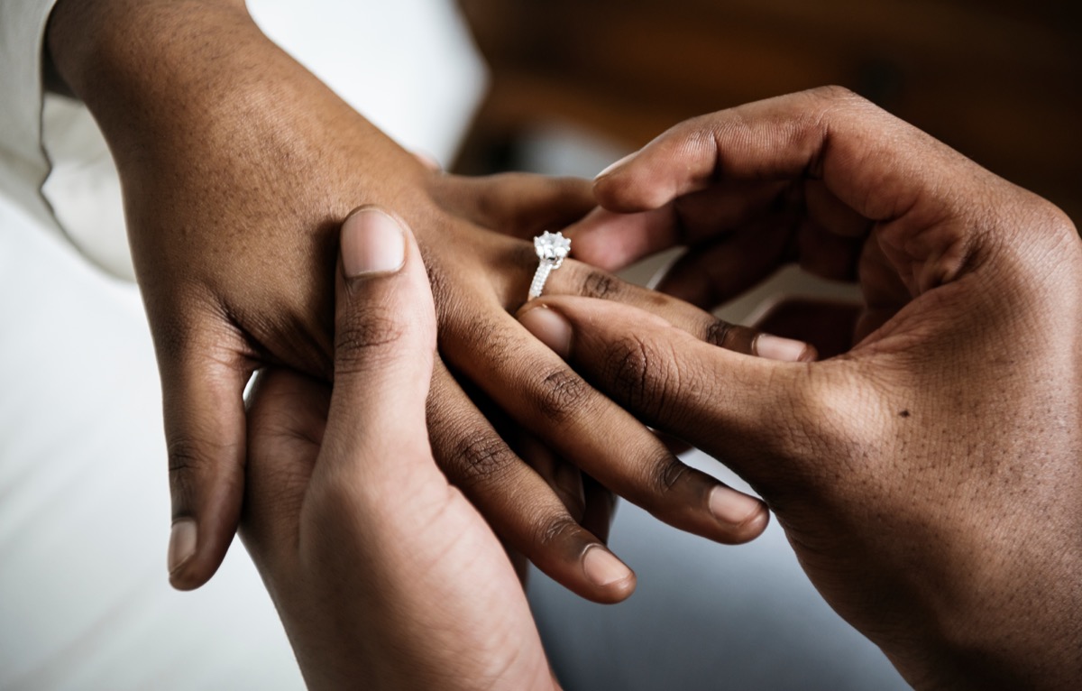 girl getting proposed to with wedding ring, relationship white lies